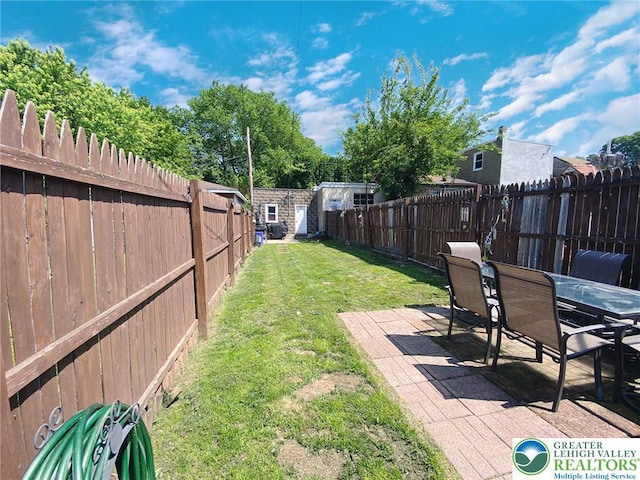 1139 Jackson St, Easton, PA 18042 - fenced backyard featuring a patio, outdoor dining area, and a shed