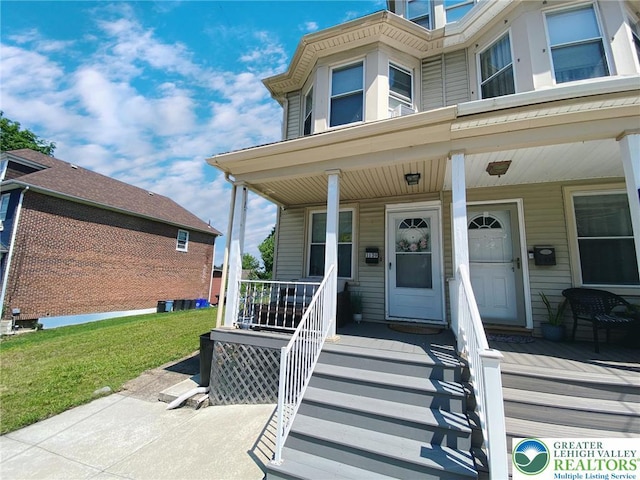1139 Jackson St, Easton, PA 18042 - view of exterior entry featuring covered porch and a lawn