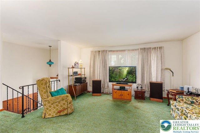 2560 Community Dr, Moore Twp, PA 18014 - living area with carpet floors and an upstairs landing