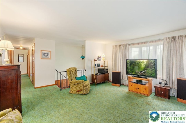 2560 Community Dr, Moore Twp, PA 18014 - living area with carpet floors and an upstairs landing