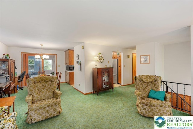 2560 Community Dr, Moore Twp, PA 18014 - living room featuring light carpet and a chandelier