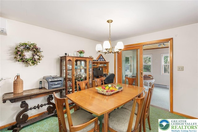 2560 Community Dr, Moore Twp, PA 18014 - carpeted dining room featuring a chandelier and a baseboard radiator