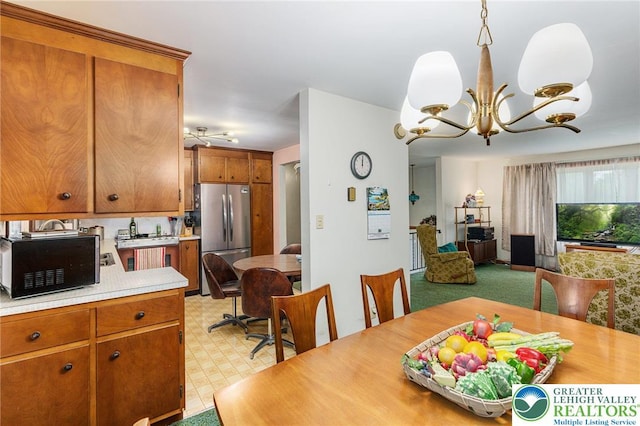 2560 Community Dr, Moore Twp, PA 18014 - dining room featuring a chandelier and light flooring