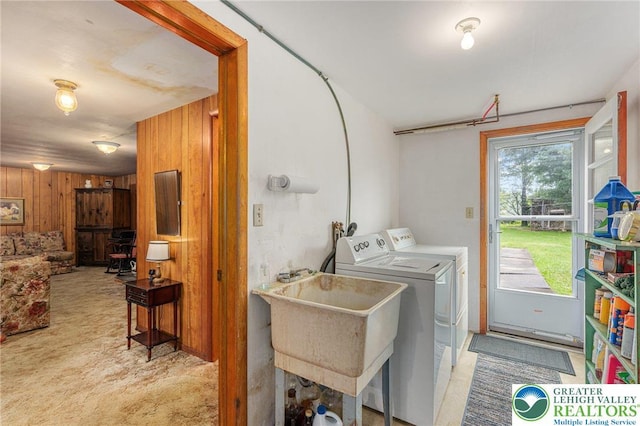 2560 Community Dr, Moore Twp, PA 18014 - laundry area featuring wood walls, washer and dryer, and carpet