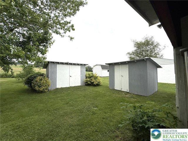 619 Penn Dr, West Penn Twp, PA 18252 - view of green lawn with a storage unit