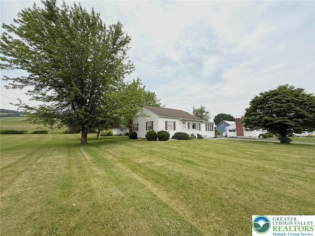 619 Penn Dr, West Penn Twp, PA 18252 - view of front of house featuring a front lawn