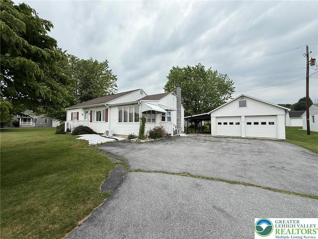 619 Penn Dr, West Penn Twp, PA 18252 - ranch-style home with a garage, a front yard, an outbuilding, and a chimney