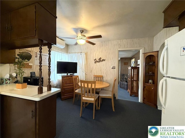619 Penn Dr, West Penn Twp, PA 18252 - dining space with a ceiling fan, dark carpet, and a wall mounted AC