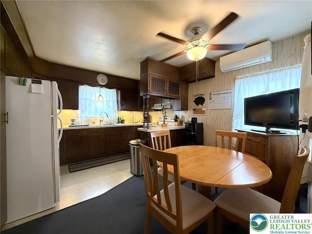 619 Penn Dr, West Penn Twp, PA 18252 - dining area featuring a wall mounted AC, a ceiling fan, and wooden walls