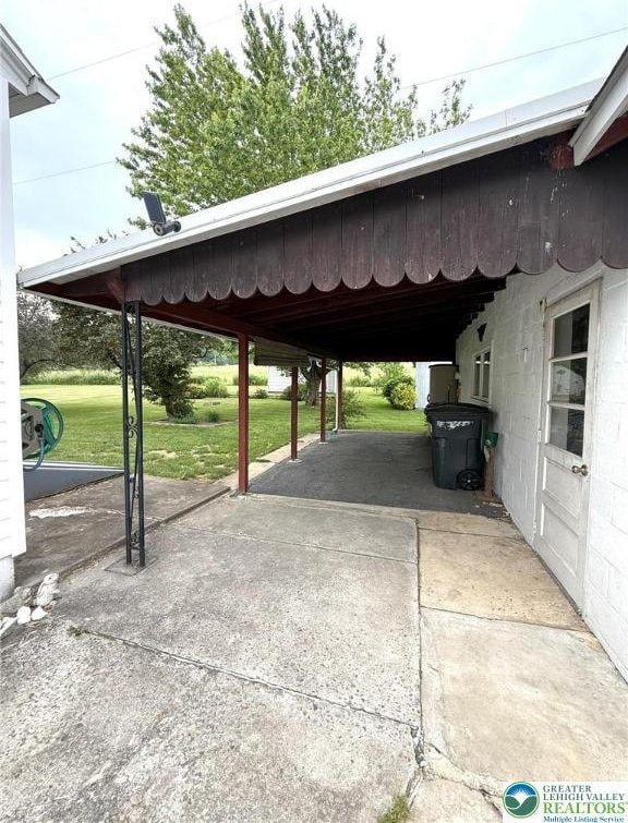 619 Penn Dr, West Penn Twp, PA 18252 - view of vehicle parking with an attached carport and concrete driveway