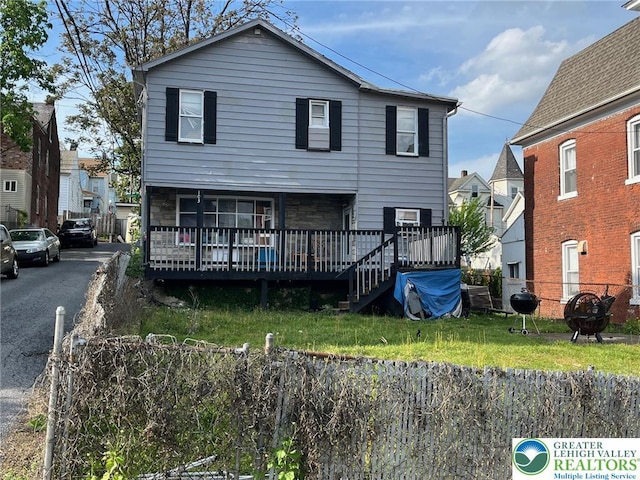 103 N Oak St, Easton, PA 18042 - view of front of home with a wooden deck and stone siding