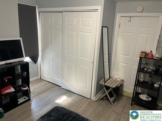 103 N Oak St, Easton, PA 18042 - bedroom with light wood-type flooring and a closet