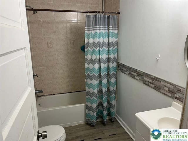 103 N Oak St, Easton, PA 18042 - bathroom featuring wood finished floors, vanity, and shower / bath combo with shower curtain
