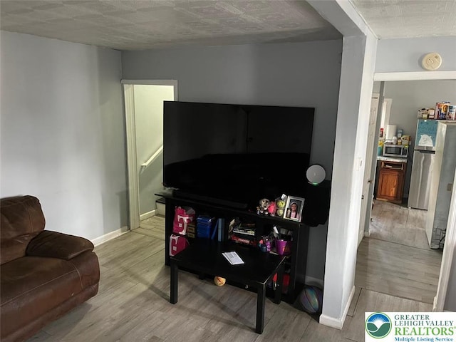103 N Oak St, Easton, PA 18042 - living room with wood finished floors and baseboards