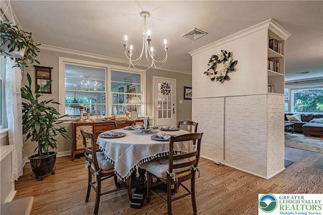 326 N Main St, Allentown City, PA 18104 - dining room with a chandelier, wood finished floors, and crown molding
