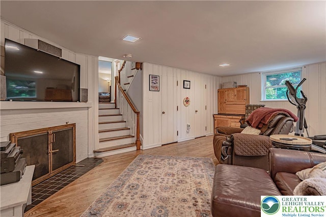 326 N Main St, Allentown City, PA 18104 - living room with stairs, wood finished floors, and a fireplace