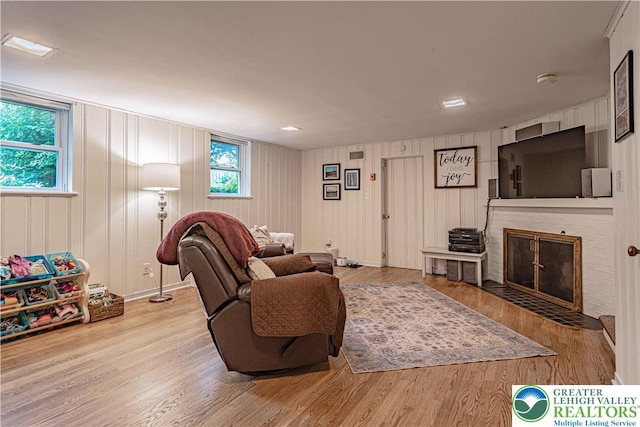 326 N Main St, Allentown City, PA 18104 - living room featuring wood finished floors, plenty of natural light, and a fireplace