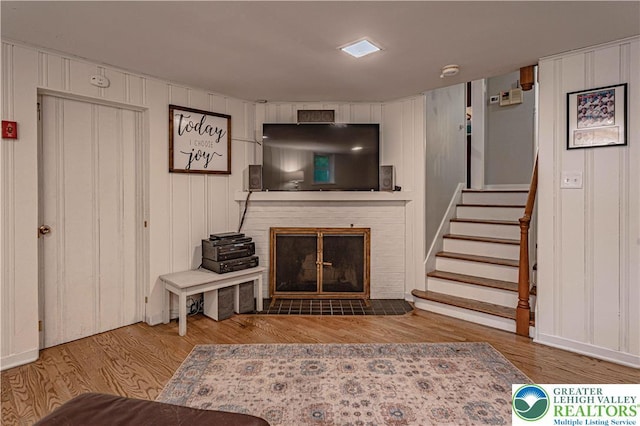 326 N Main St, Allentown City, PA 18104 - living room with stairs, a fireplace, and wood finished floors