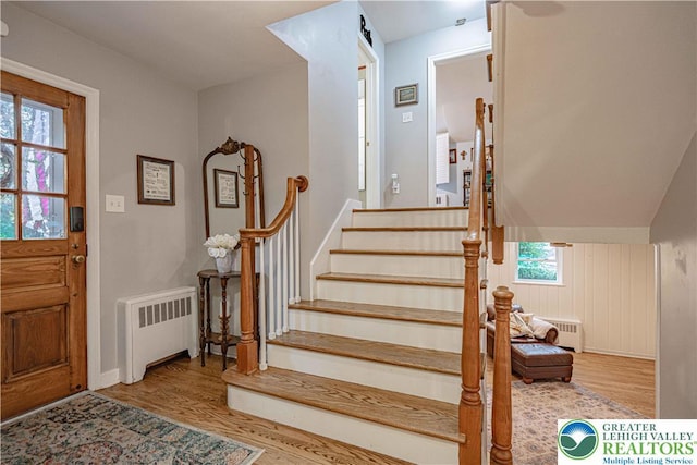 326 N Main St, Allentown City, PA 18104 - foyer entrance with radiator heating unit, wood finished floors, and stairway