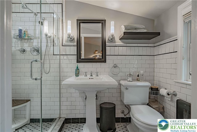 326 N Main St, Allentown City, PA 18104 - full bathroom with a stall shower, tile walls, vaulted ceiling, and tile patterned floors