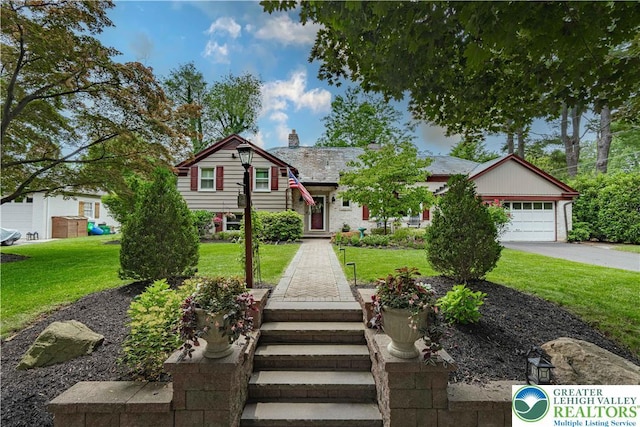 326 N Main St, Allentown City, PA 18104 - split level home with a chimney, a front yard, driveway, and an attached garage