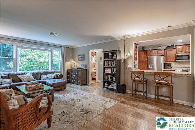 326 N Main St, Allentown City, PA 18104 - living room with ornamental molding and light wood-type flooring