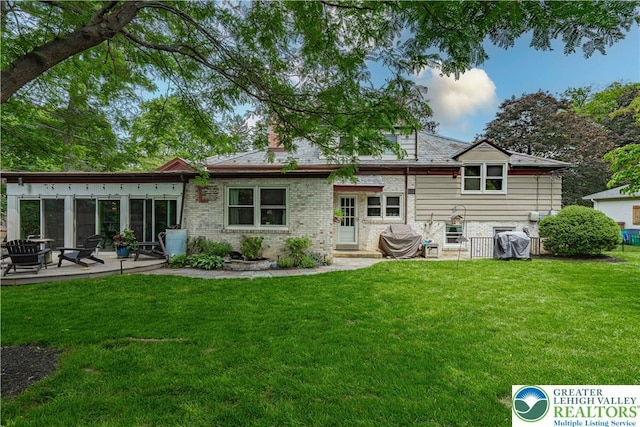 326 N Main St, Allentown City, PA 18104 - back of house with a patio area and brick siding