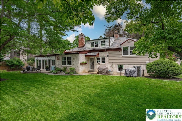 326 N Main St, Allentown City, PA 18104 - rear view of house featuring a chimney, a patio area, and brick siding