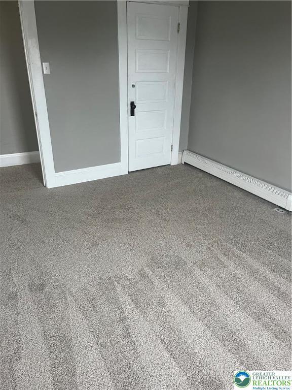 827 Louis St, Easton, PA 18042 - unfurnished room featuring a baseboard radiator and carpet