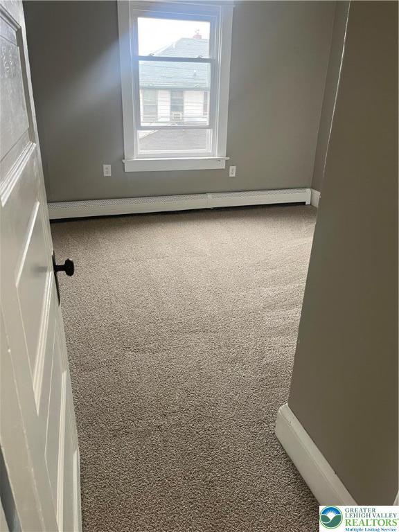 827 Louis St, Easton, PA 18042 - empty room with carpet flooring and baseboard heating