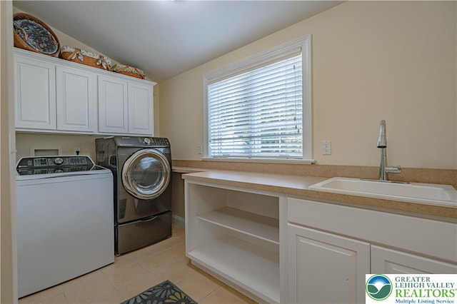 3054 Jordan Rd, North Whitehall Twp, PA 18069 - laundry area featuring cabinet space, washer and dryer, and light tile patterned floors