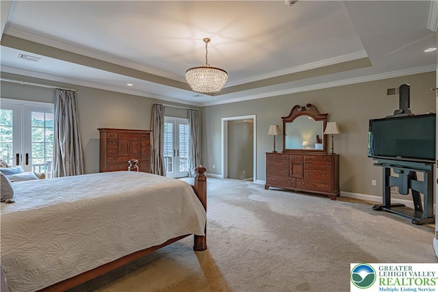 3054 Jordan Rd, North Whitehall Twp, PA 18069 - carpeted bedroom featuring a tray ceiling, french doors, recessed lighting, crown molding, and a chandelier