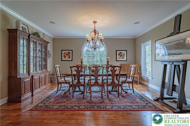 3054 Jordan Rd, North Whitehall Twp, PA 18069 - dining space featuring a chandelier, wood finished floors, and crown molding