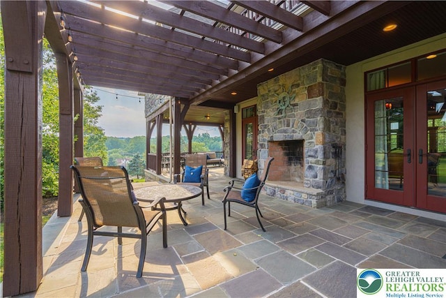 3054 Jordan Rd, North Whitehall Twp, PA 18069 - view of patio with french doors, an outdoor stone fireplace, and a pergola