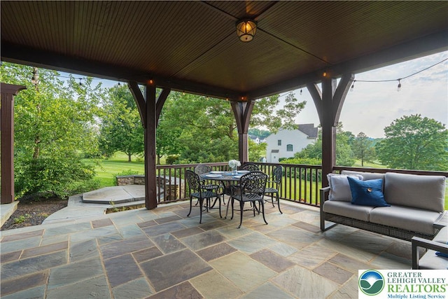 3054 Jordan Rd, North Whitehall Twp, PA 18069 - view of patio / terrace featuring outdoor dining area, an outdoor living space, and view of wooded area