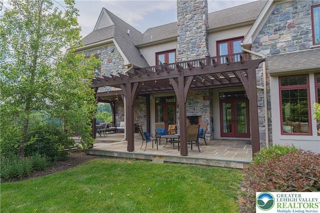 3054 Jordan Rd, North Whitehall Twp, PA 18069 - back of house with french doors, stone siding, stucco siding, a yard, and a patio