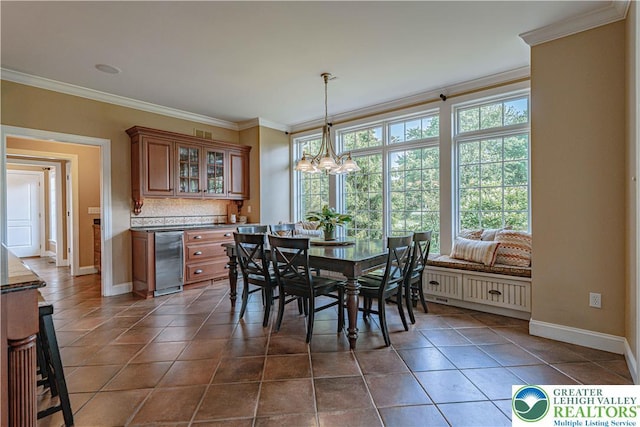 3054 Jordan Rd, North Whitehall Twp, PA 18069 - dining space featuring ornamental molding, dark tile patterned flooring, and a chandelier