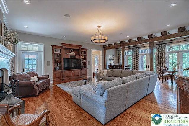 3054 Jordan Rd, North Whitehall Twp, PA 18069 - living room with a chandelier, light wood-type flooring, and recessed lighting
