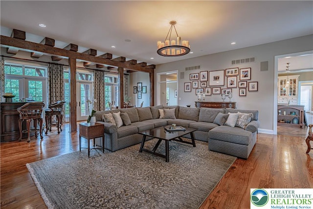 3054 Jordan Rd, North Whitehall Twp, PA 18069 - living room featuring wood finished floors, recessed lighting, a chandelier, and french doors