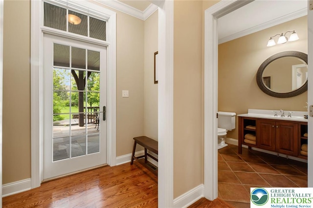 3054 Jordan Rd, North Whitehall Twp, PA 18069 - doorway with ornamental molding and dark wood-style floors