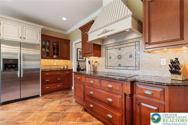 3054 Jordan Rd, North Whitehall Twp, PA 18069 - kitchen featuring stainless steel refrigerator with ice dispenser, custom exhaust hood, black electric stovetop, ornamental molding, and tasteful backsplash