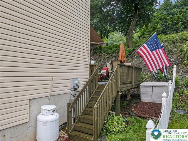 617 Lehigh Gap St, Walnutport Boro, PA 18088 - view of home's exterior with a wooden deck, stairway, and view of scattered trees