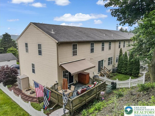 617 Lehigh Gap St, Walnutport Boro, PA 18088 - back of house with a deck, a fenced backyard, and a shingled roof