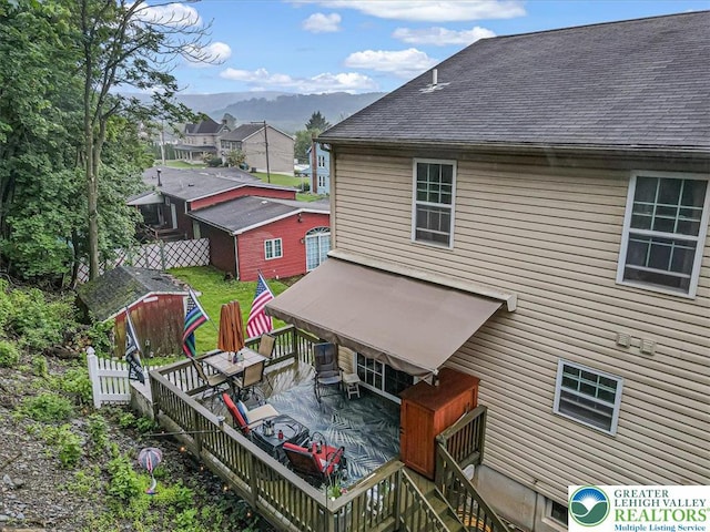 617 Lehigh Gap St, Walnutport Boro, PA 18088 - back of property with roof with shingles and a deck