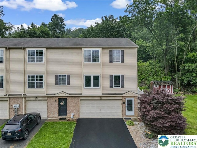 617 Lehigh Gap St, Walnutport Boro, PA 18088 - view of property with a garage, driveway, and brick siding