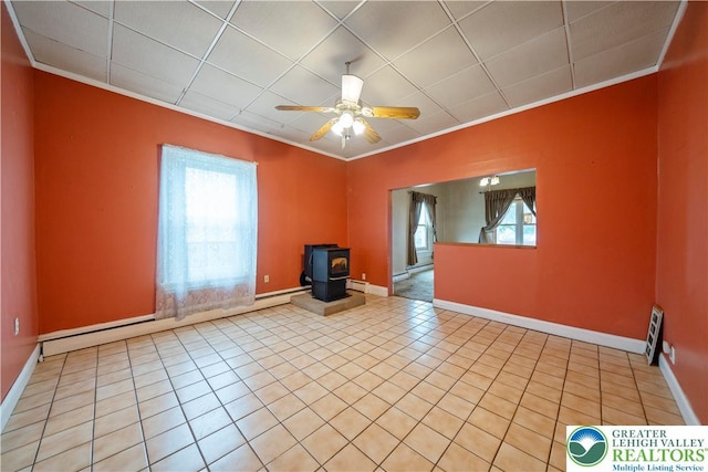 20 N 3rd St, Coplay Boro, PA 18037 - unfurnished living room featuring crown molding, ceiling fan, a wood stove, and tile patterned floors