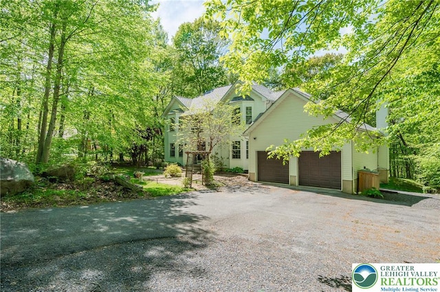 1661 Marjorie Ct, Middle Smithfield Twp, PA 18302 - view of front of home with asphalt driveway and a chimney