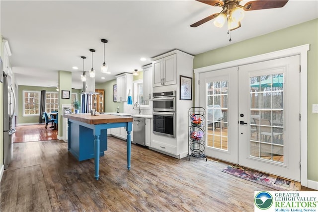 1661 Marjorie Ct, Middle Smithfield Twp, PA 18302 - kitchen featuring butcher block counters, appliances with stainless steel finishes, ceiling fan, french doors, and wood finished floors