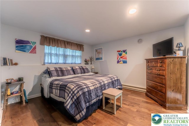 3195 Audubon St, Palmer Twp, PA 18045 - bedroom featuring a baseboard radiator, light wood-style flooring, and recessed lighting