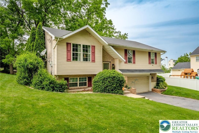 3195 Audubon St, Palmer Twp, PA 18045 - split foyer home featuring driveway, an attached garage, and brick siding